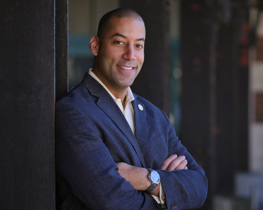 Sean Spiller posing while smiling with his arms crossed looking into the camera